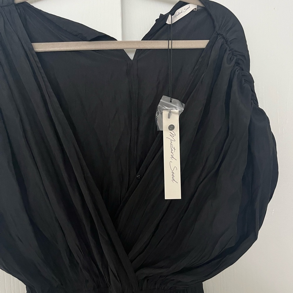 Brand new with bags Mustard Seed black jumpsuit size large.